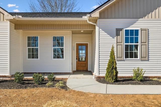 doorway to property with board and batten siding