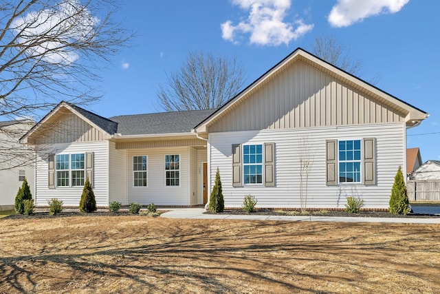 single story home featuring board and batten siding