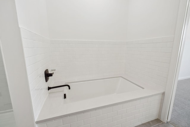 bathroom featuring a garden tub