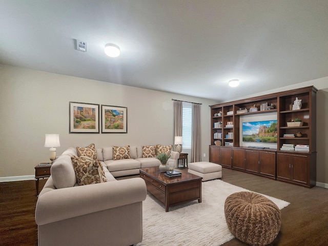 living room featuring visible vents and baseboards