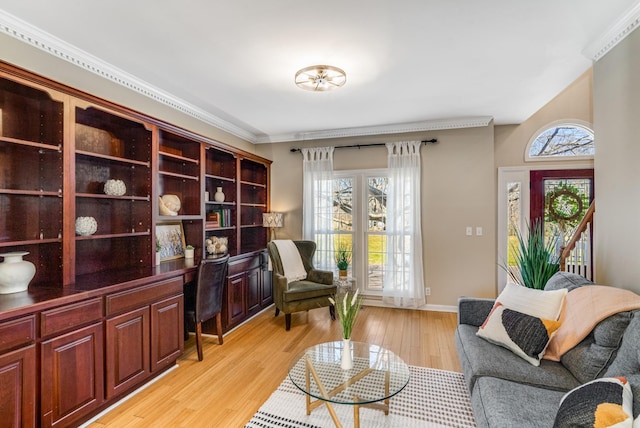 living area with light wood-type flooring and baseboards