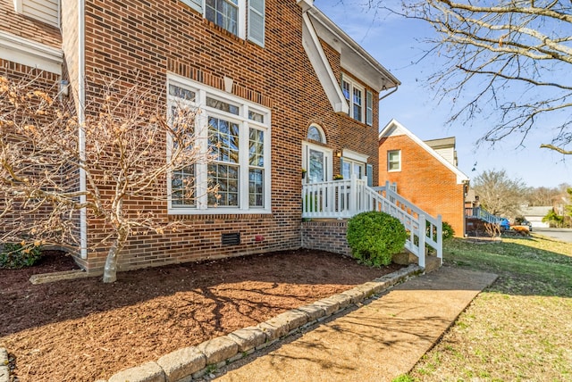 view of side of property with brick siding