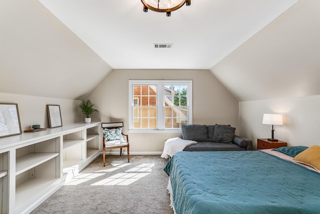 carpeted bedroom featuring lofted ceiling, baseboards, and visible vents