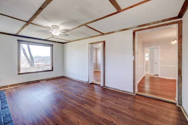 spare room featuring a ceiling fan, wood finished floors, and ornamental molding