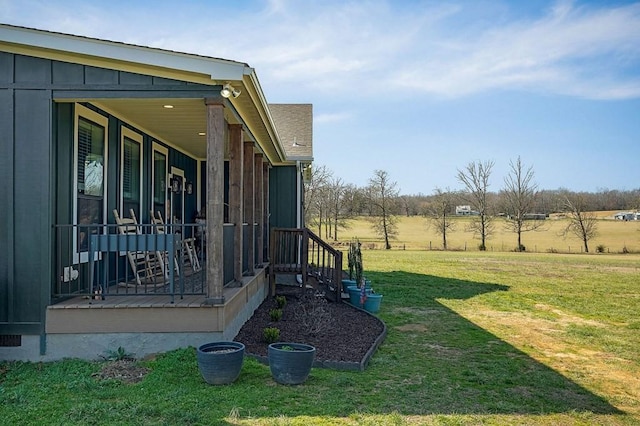 view of yard featuring covered porch