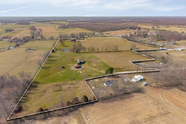 birds eye view of property featuring a rural view