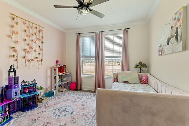 bedroom with ceiling fan, baseboards, and ornamental molding