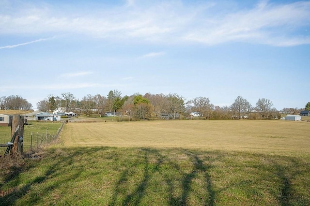 view of yard with a rural view