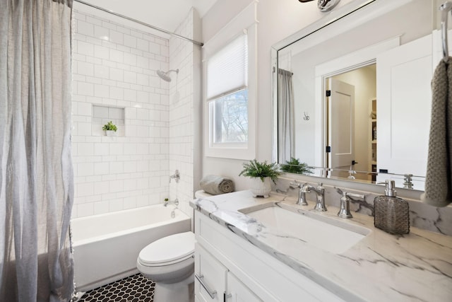 bathroom featuring shower / bath combination with curtain, toilet, and vanity