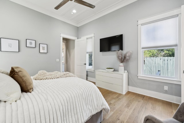 bedroom featuring light wood finished floors, ceiling fan, baseboards, ornamental molding, and recessed lighting