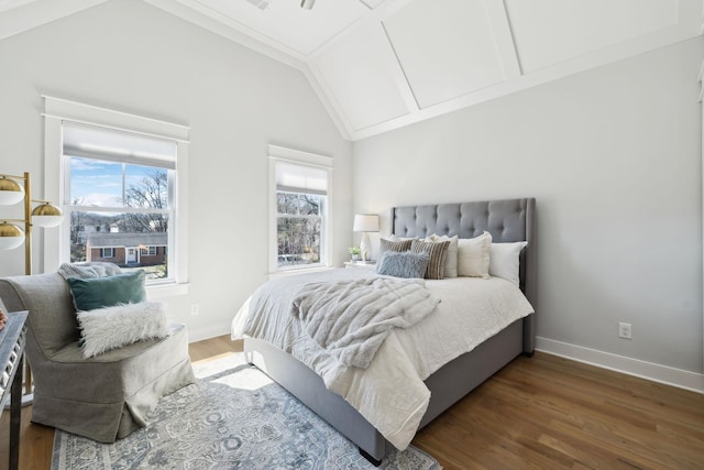 bedroom featuring baseboards, high vaulted ceiling, and wood finished floors