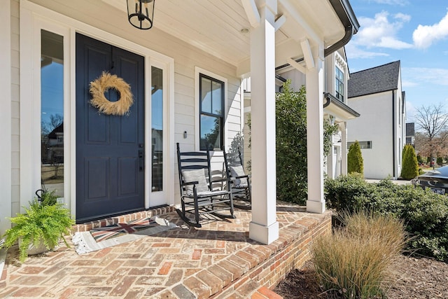 property entrance with covered porch