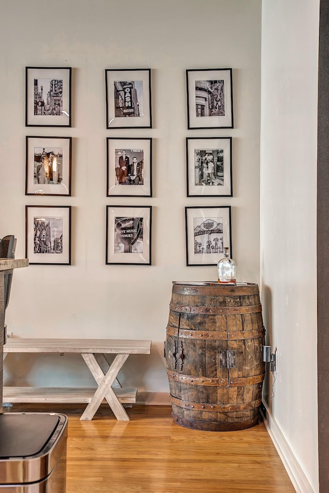 room details with baseboards and wood finished floors