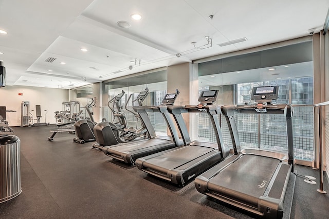 gym featuring recessed lighting and visible vents