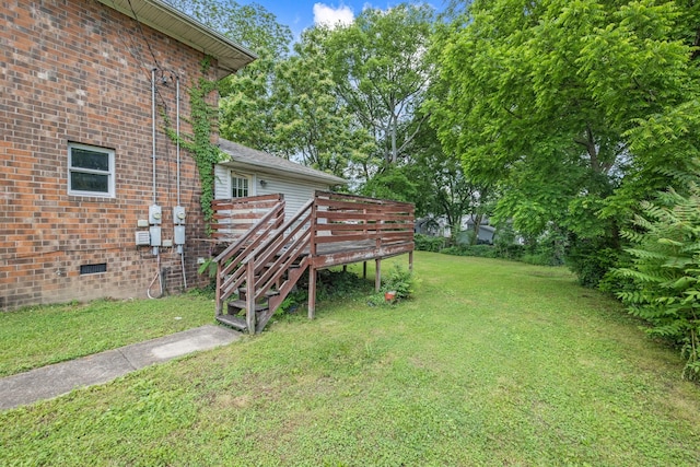 view of yard featuring stairs and a wooden deck