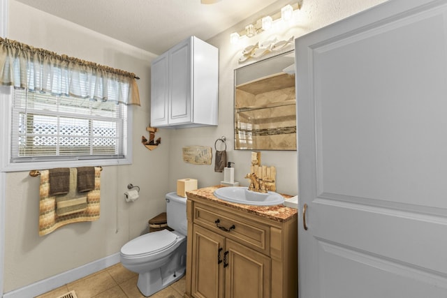 full bathroom with toilet, tile patterned flooring, baseboards, walk in shower, and vanity