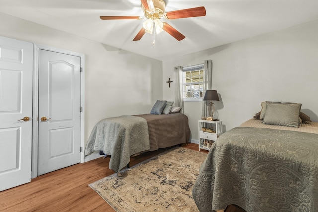 bedroom featuring wood finished floors and ceiling fan