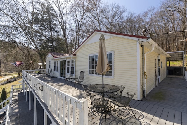 deck with outdoor dining space