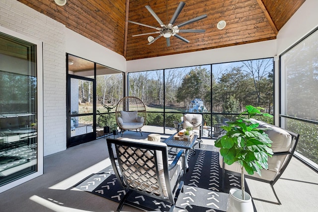 sunroom featuring a healthy amount of sunlight, wooden ceiling, and lofted ceiling