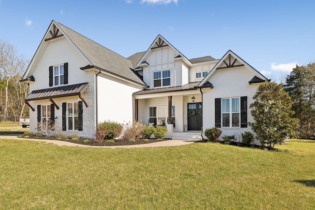 modern farmhouse style home with a front lawn, a standing seam roof, board and batten siding, metal roof, and brick siding