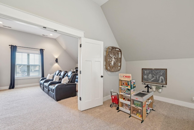 recreation room featuring lofted ceiling, carpet flooring, baseboards, and visible vents