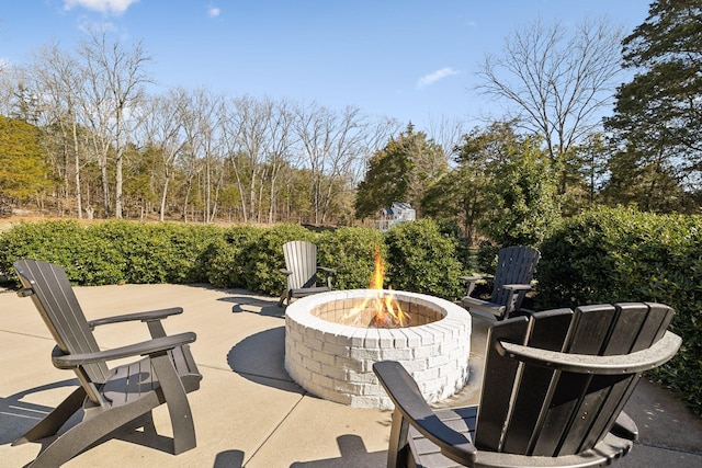 view of patio / terrace with an outdoor fire pit