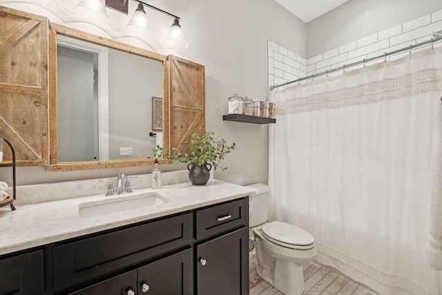 full bathroom with vanity, toilet, and a shower with curtain