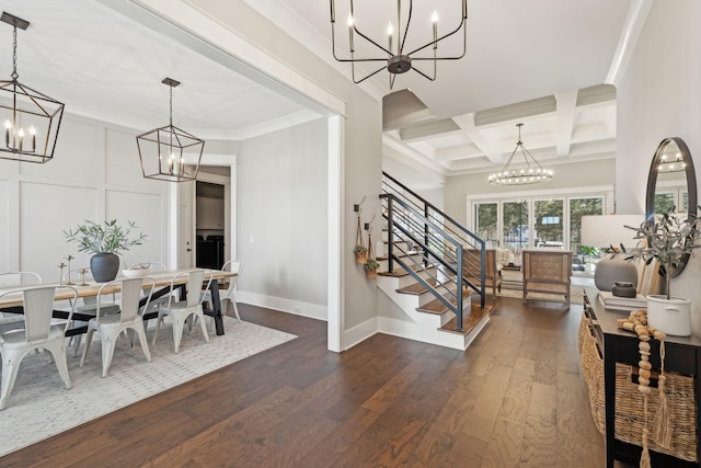 dining space with beam ceiling, coffered ceiling, dark wood-style floors, a chandelier, and stairs