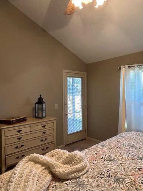 bedroom with lofted ceiling, carpet floors, and ceiling fan