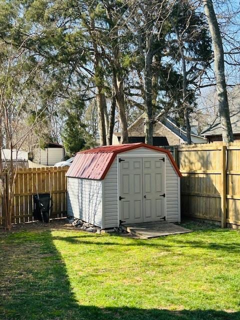 view of shed featuring a fenced backyard