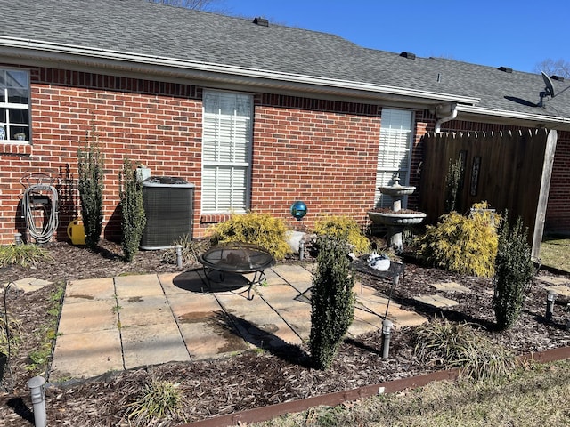 view of patio / terrace featuring central AC and fence