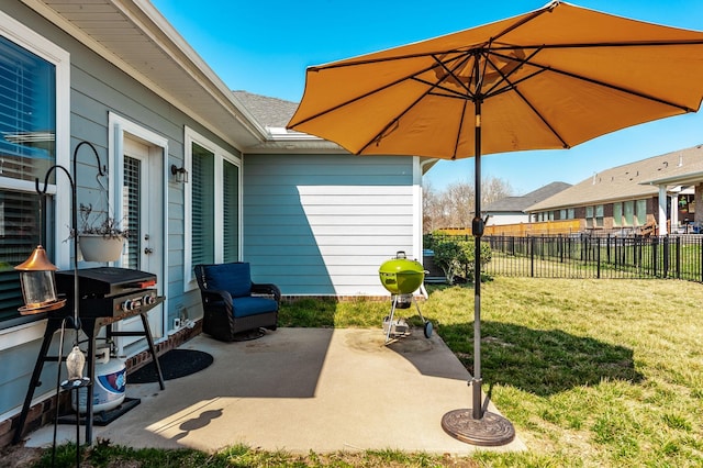 view of patio featuring fence