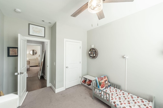 bedroom with visible vents, ceiling fan, baseboards, and carpet