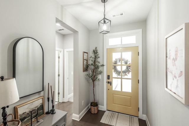 entrance foyer with dark wood finished floors, baseboards, and visible vents