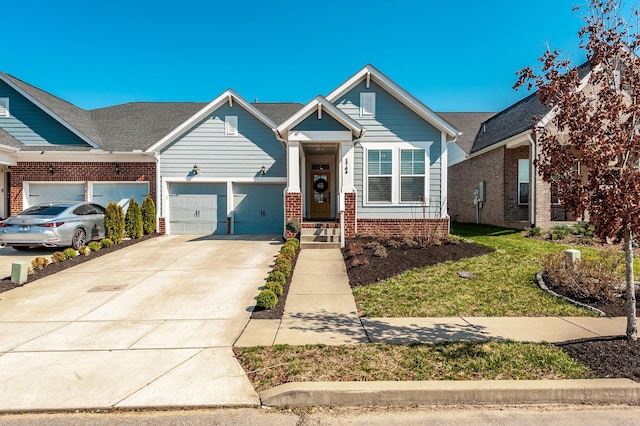 view of front of house with brick siding, concrete driveway, a garage, and a front yard