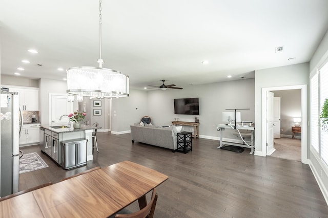 dining area featuring recessed lighting, visible vents, a healthy amount of sunlight, and dark wood-style floors