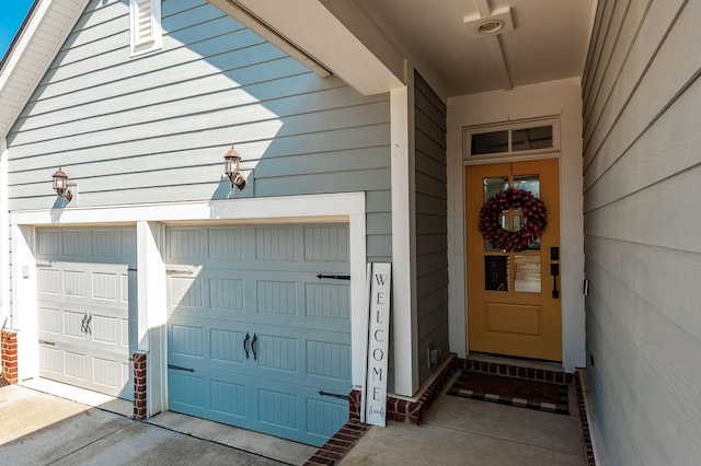 doorway to property featuring a garage