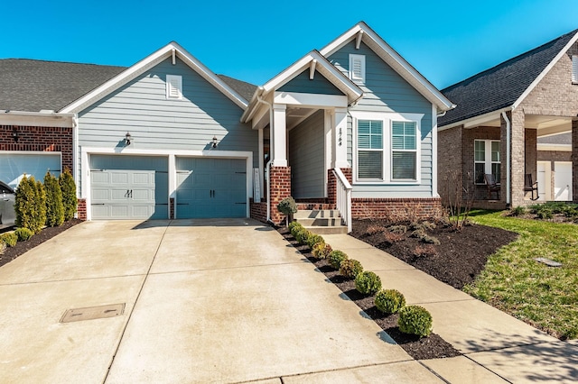 view of front of home featuring a garage, brick siding, and driveway