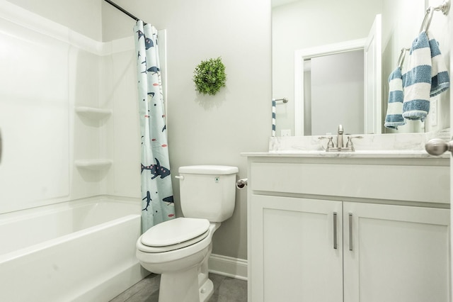 bathroom with toilet, vanity, baseboards, and shower / bath combo