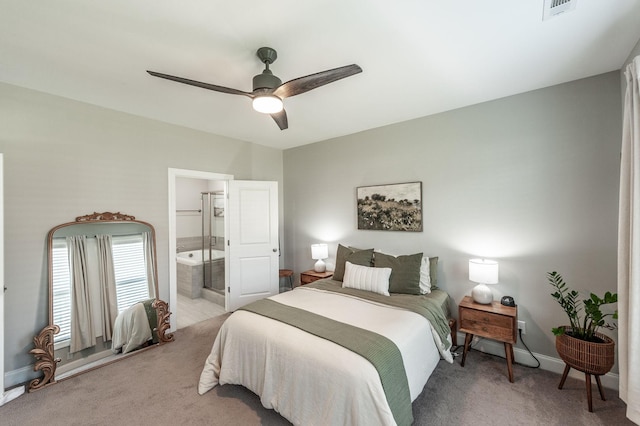 carpeted bedroom featuring connected bathroom, visible vents, baseboards, and ceiling fan