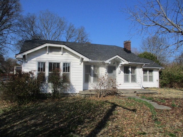 view of front of property featuring a chimney