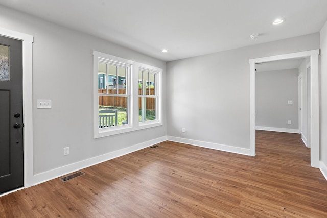 entryway with visible vents, recessed lighting, baseboards, and wood finished floors