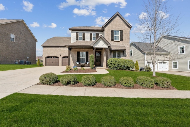 view of front of property with brick siding, central AC unit, driveway, and a front yard