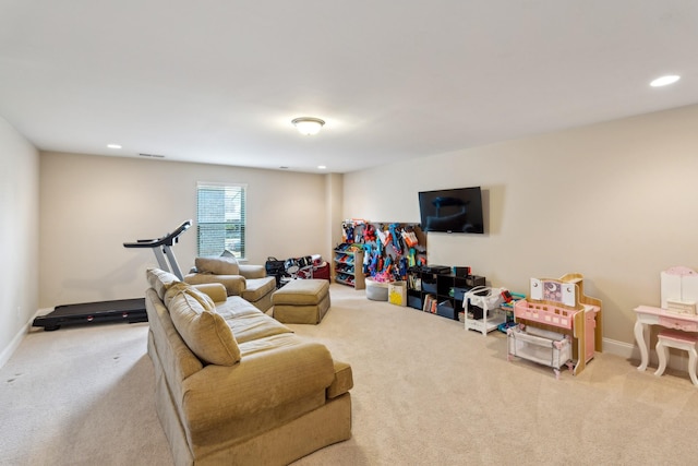 carpeted living area with recessed lighting, visible vents, and baseboards