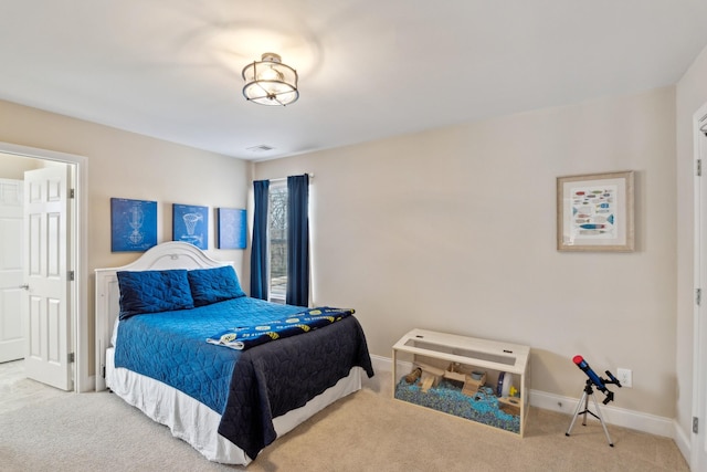 bedroom with baseboards and carpet flooring