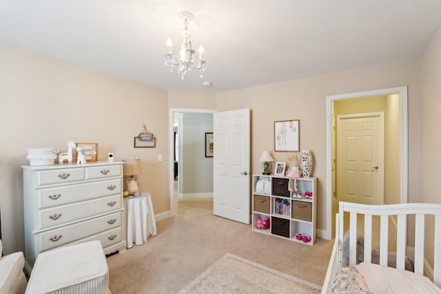 bedroom with light colored carpet, baseboards, and a chandelier