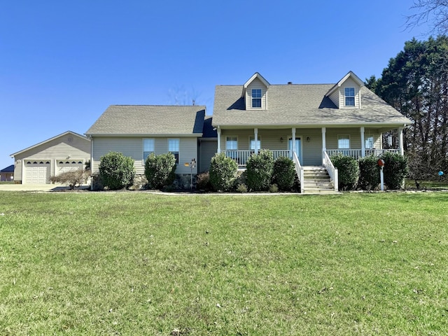 cape cod home with an outbuilding, a garage, a porch, and a front lawn