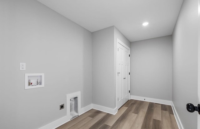 washroom with hookup for a washing machine, baseboards, dark wood-style flooring, and electric dryer hookup