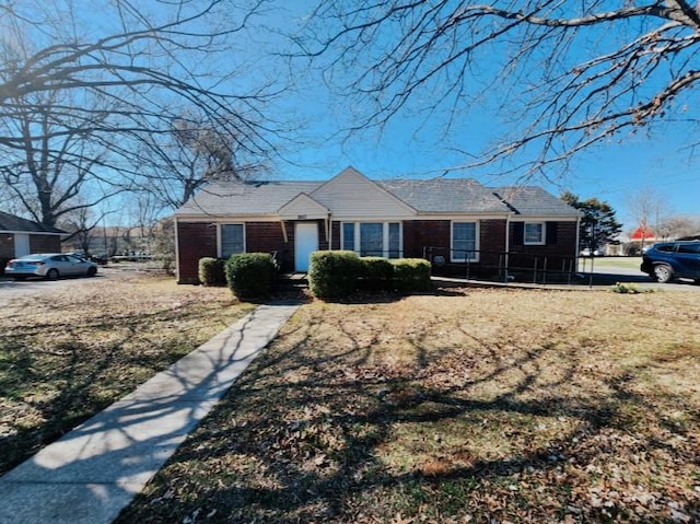 single story home with brick siding