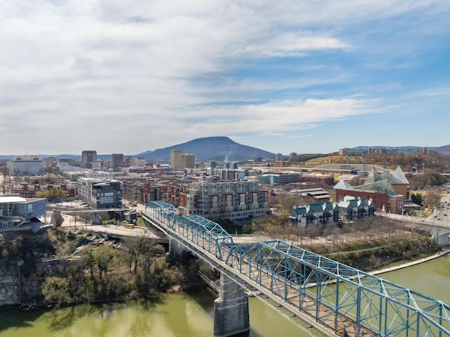 exterior space featuring a city view and a water and mountain view